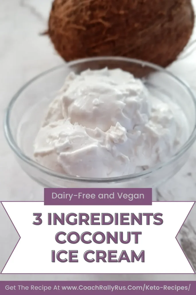 Delicious Keto Coconut Ice Cream served in a clear glass bowl, garnished with desiccated coconut, against a white background with a whole coconut. Text overlay reads ‘Dairy-Free and Vegan, 3 Ingredients Coconut Ice Cream. Get The Recipe At www.CoachRallyRus.com/Keto-Recipes.