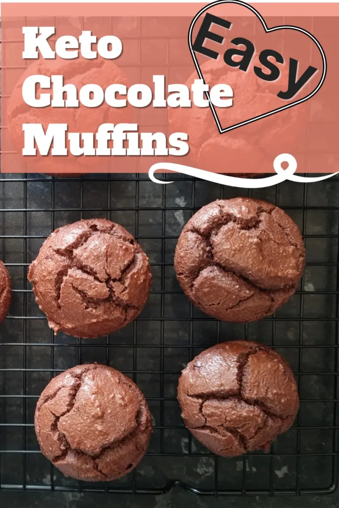 Close up of freshly baked keto chocolate muffins on a wire cooling rack.