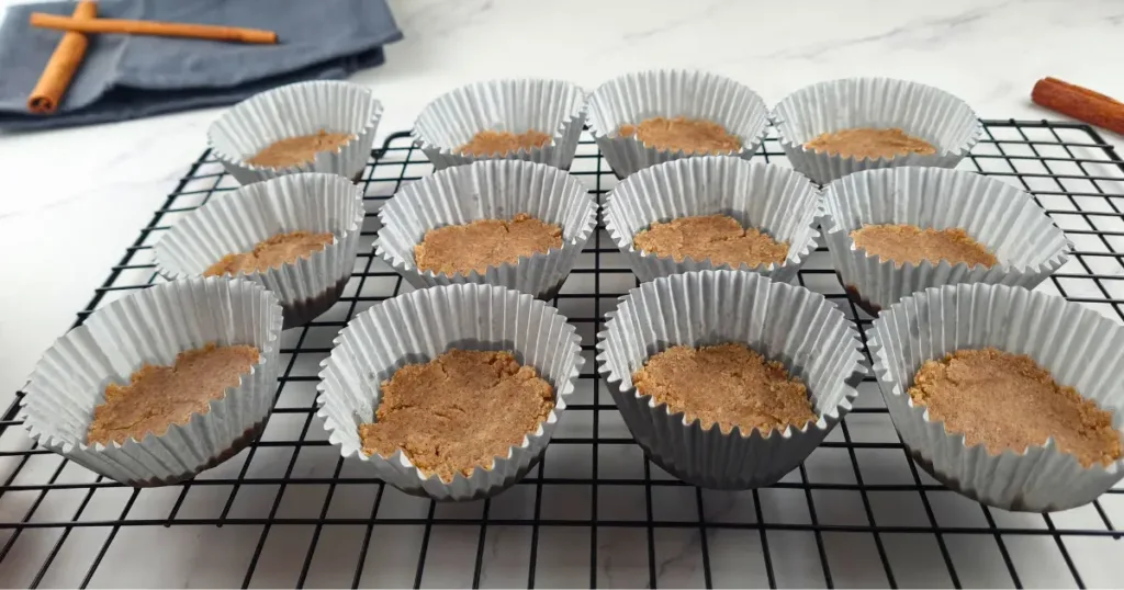 12 Keto Gingerbread Cheesecakes on a cooling rug