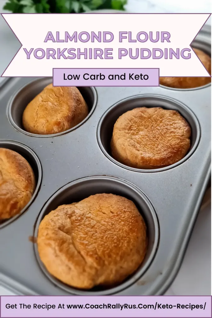 A Pinterest pin showcasing freshly baked almond flour Yorkshire puddings in a muffin tray, labeled as low carb and keto-friendly, with a link to the recipe at the bottom.