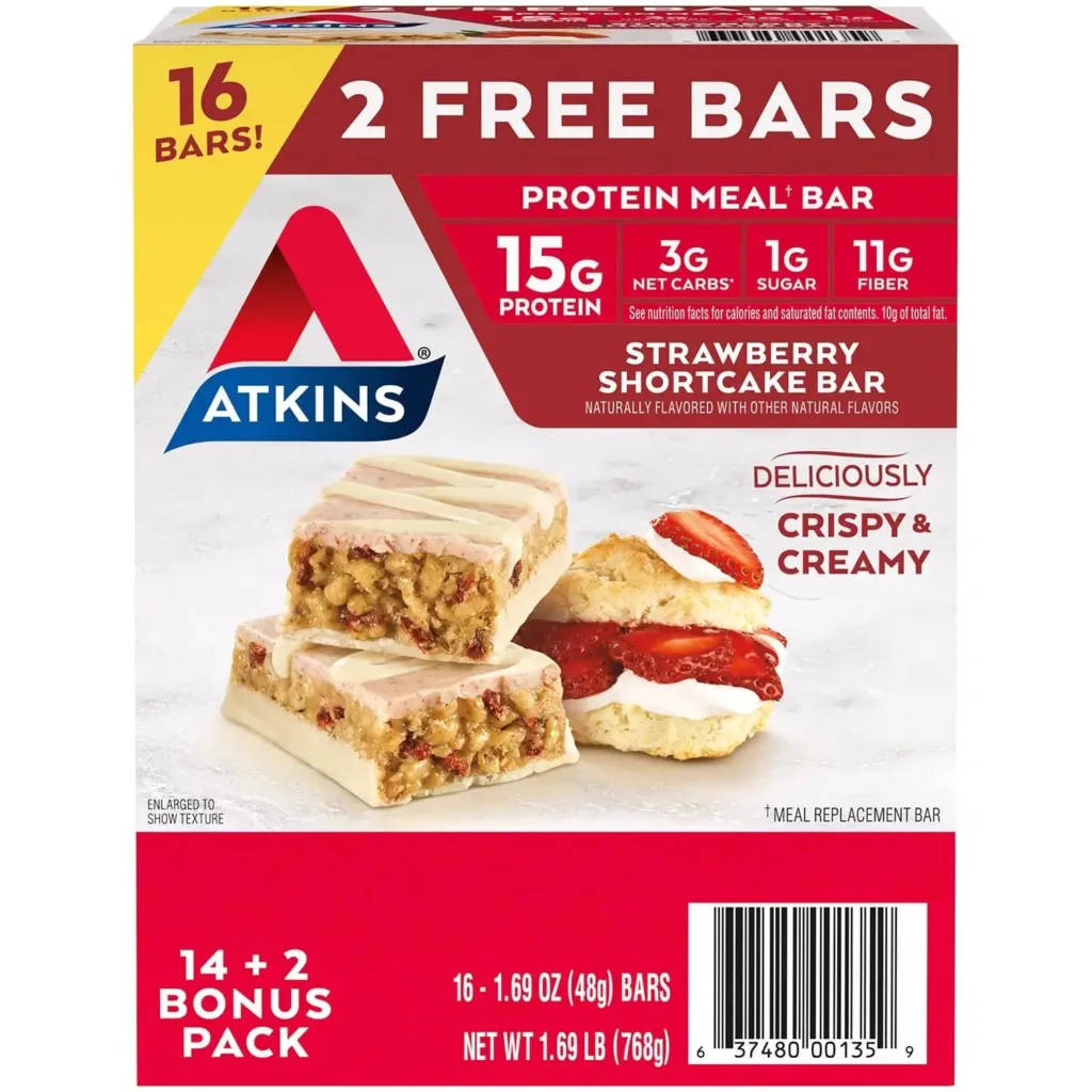 A box of Atkins Strawberry Shortcake Protein Meal Bars is displayed, highlighting its nutritional benefits and a special offer of 2 free bars in the pack, enticing customers with both health and value.