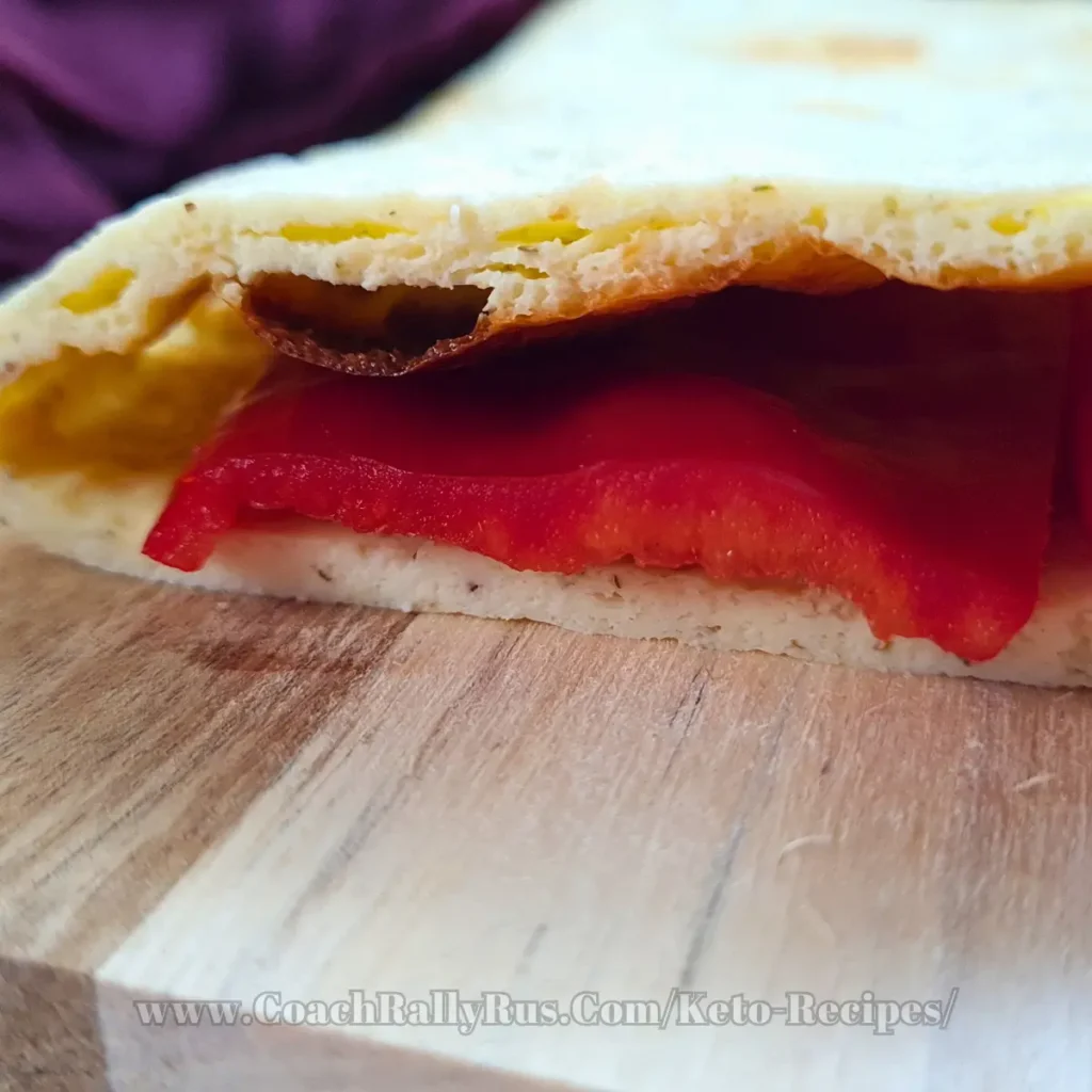 Golden-brown cottage cheese flatbread with a crispy edge, fresh out of the oven, displayed on a light countertop, embodying the simplicity and deliciousness of keto-friendly recipes.