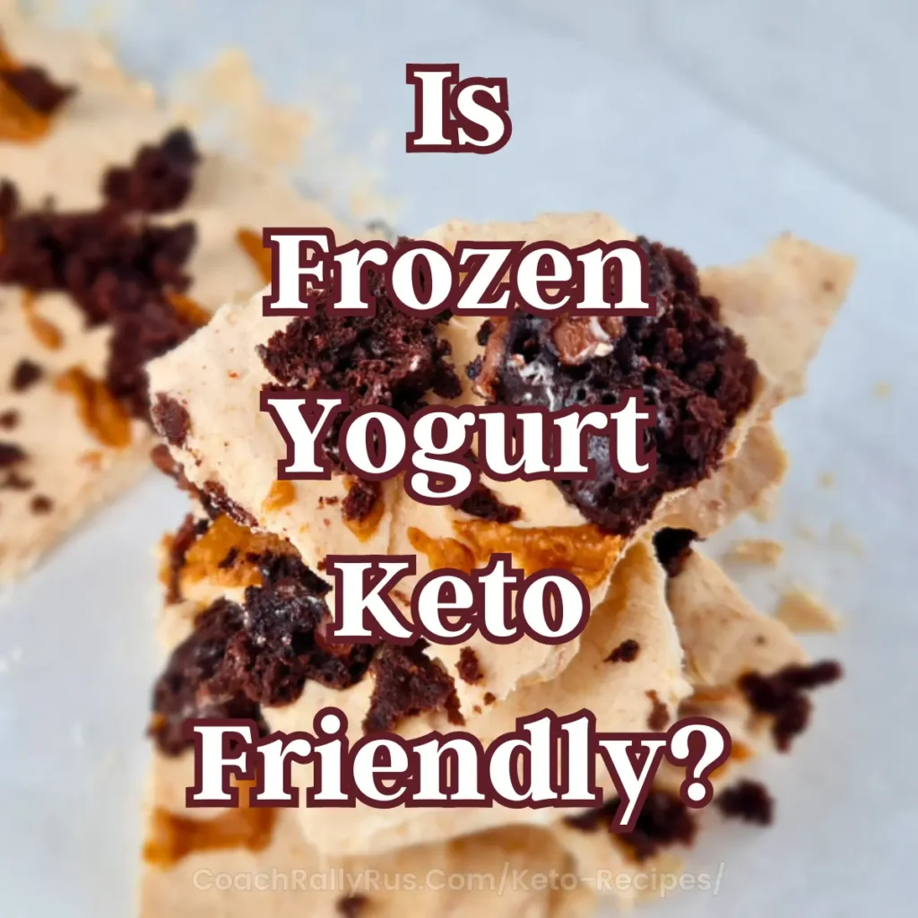 A close-up image of broken pieces of frozen yogurt bark with dark chocolate chunks on a light surface, with the text “Is Frozen Yogurt Keto Friendly?” in bold white and pink letters.