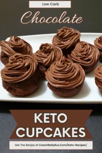 A collection of low-carb keto cupcakes topped with a swirl of chocolate cream cheese frosting, displayed against a dark background.