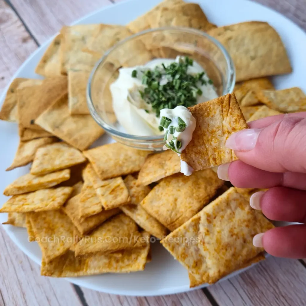 3-Ingredient Keto Crackers on a wooden board with a small bowl of dip