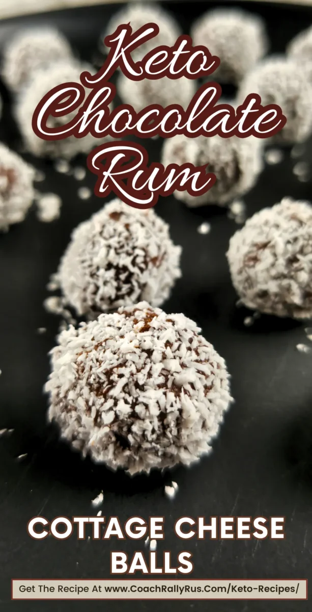 Keto chocolate cottage cheese rum balls with coconut coating, displayed on a dark plate.