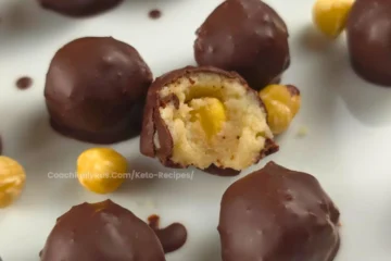 Keto Chocolate Hazelnut Cottage Cheese Bonbon with a bite, showing creamy filling