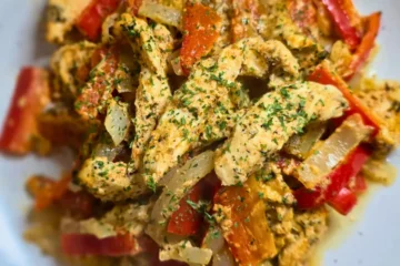 Keto chicken gyro casserole with melted cheese and Greek seasoning.