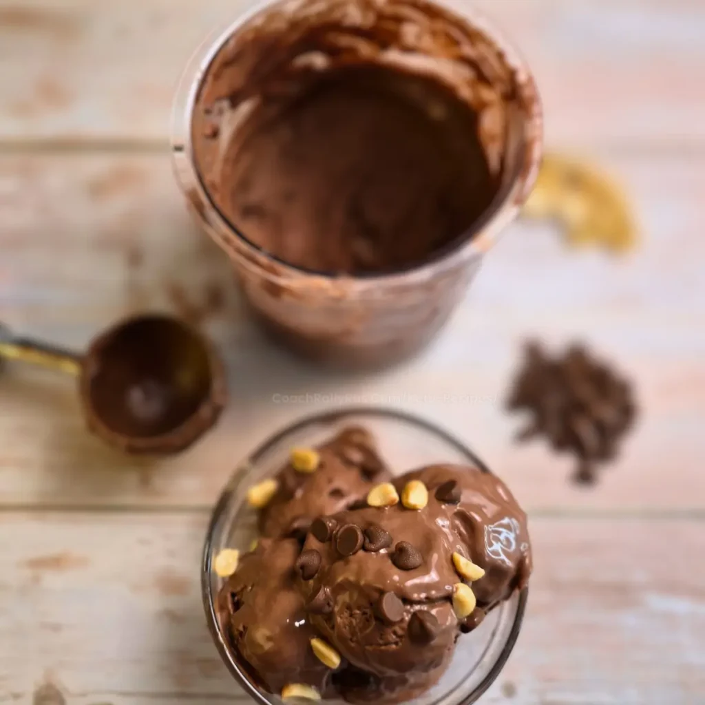 Keto chocolate peanut butter ice cream close-up with chocolate chips and peanuts