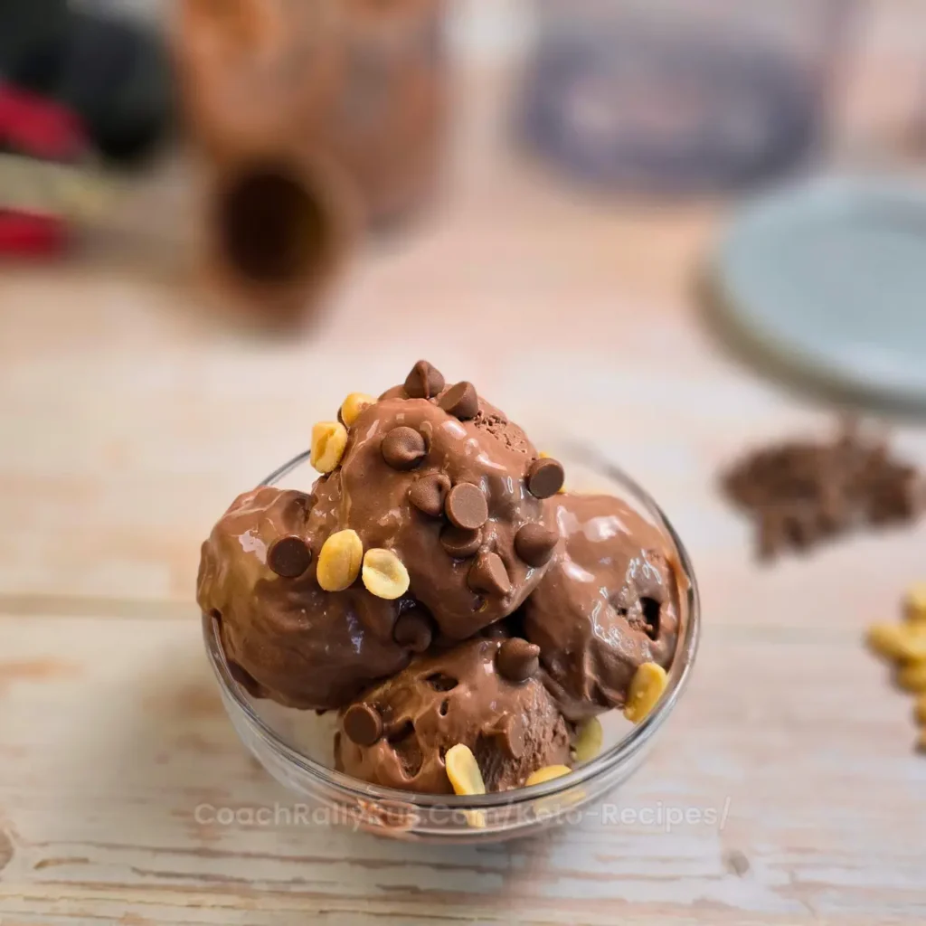 Keto chocolate peanut butter ice cream close-up with chocolate chips and peanuts