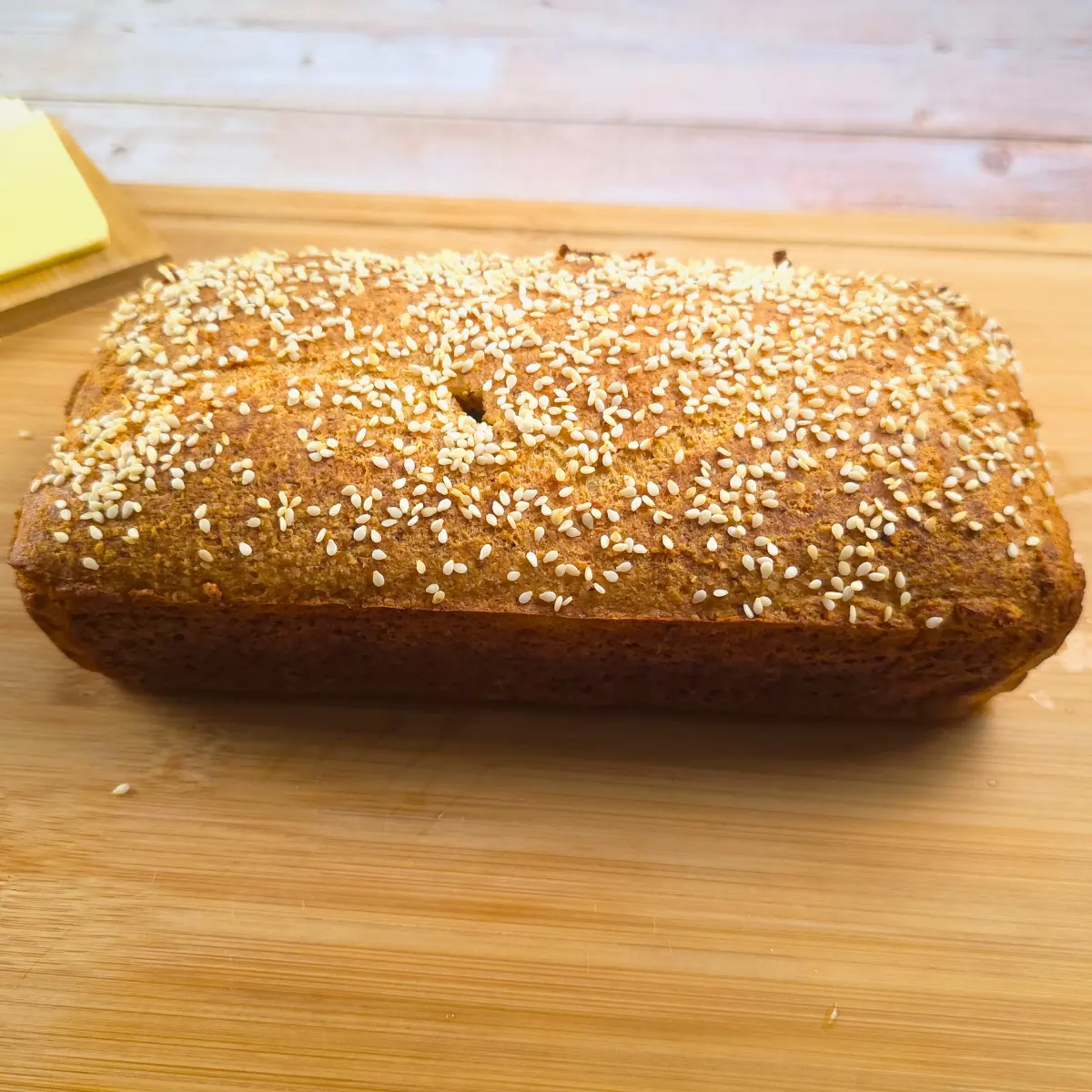 keto cottage cheese bread loaf with sesame seed topping