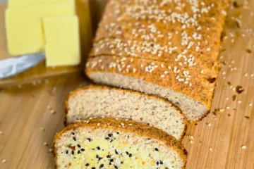 sliced eggless high protein keto bread with melted butter and everything bagel seasoning