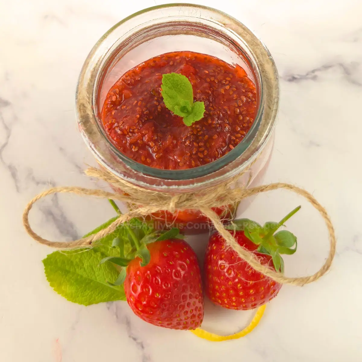 Overhead shot of keto strawberry chia jam topped with mint