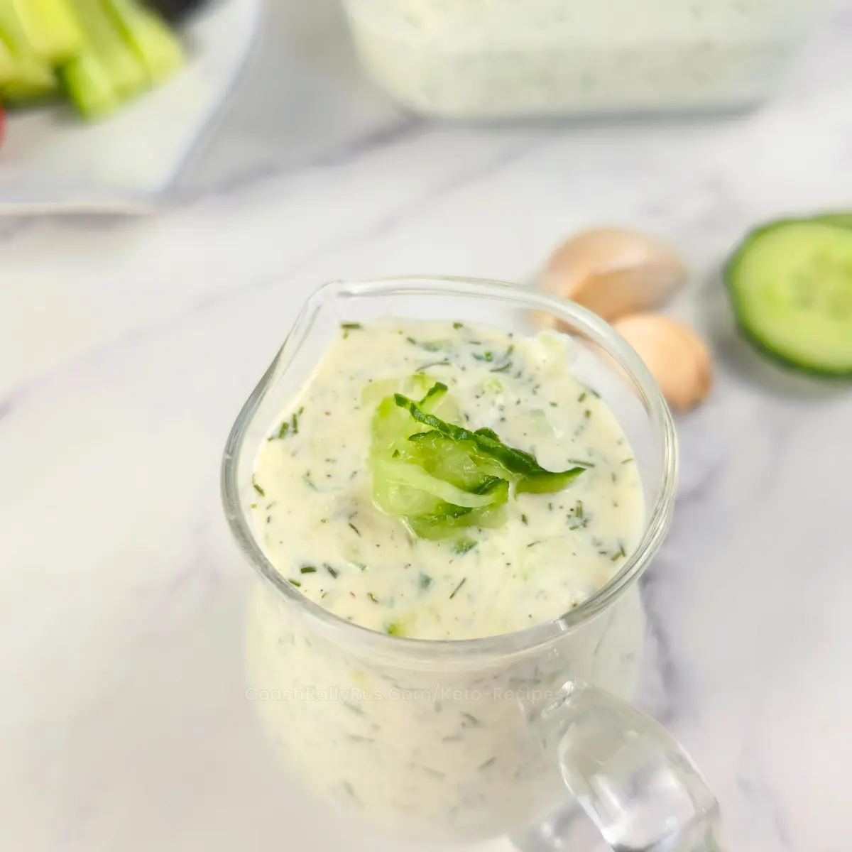 Closeup of cottage cheese tzatziki with cucumber garnish