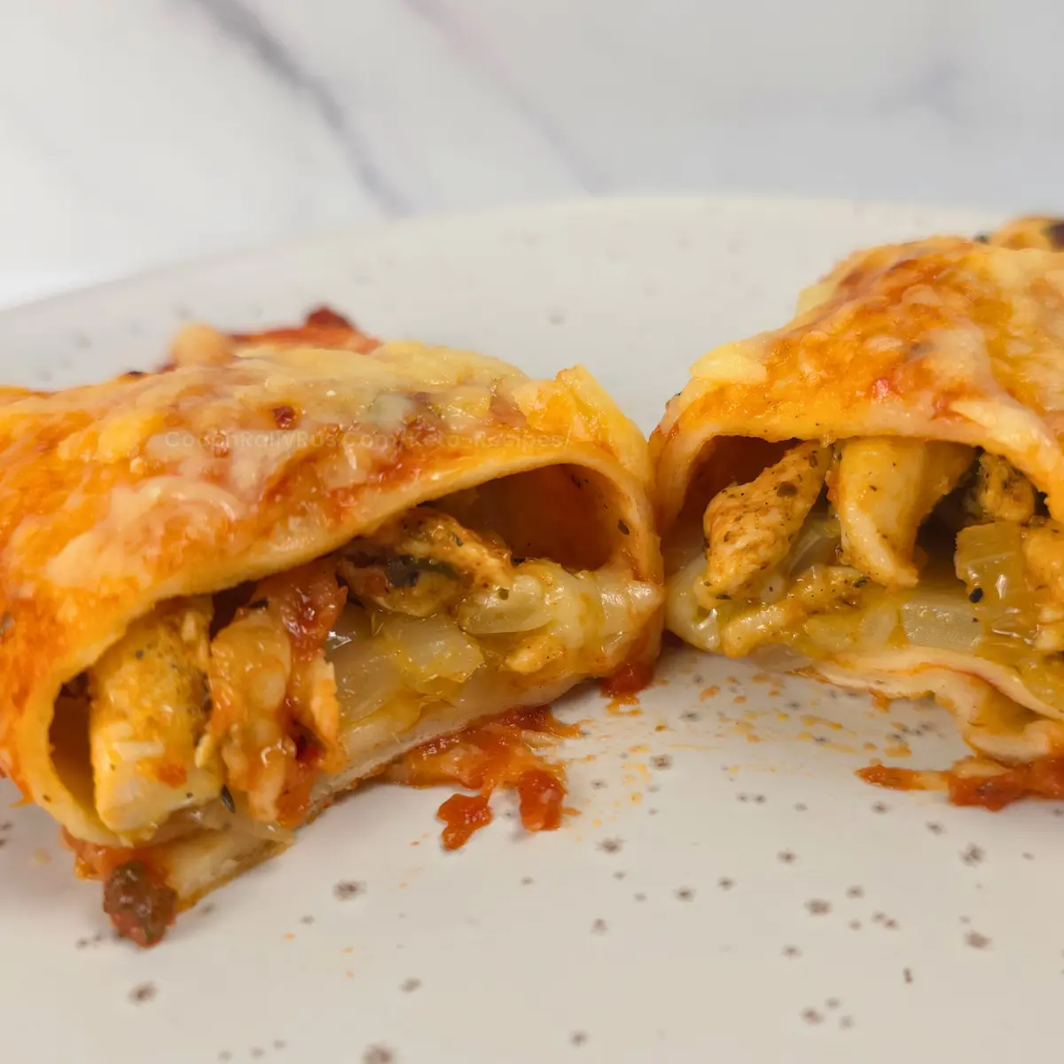 Inside view of sliced keto chicken enchilada showing filling