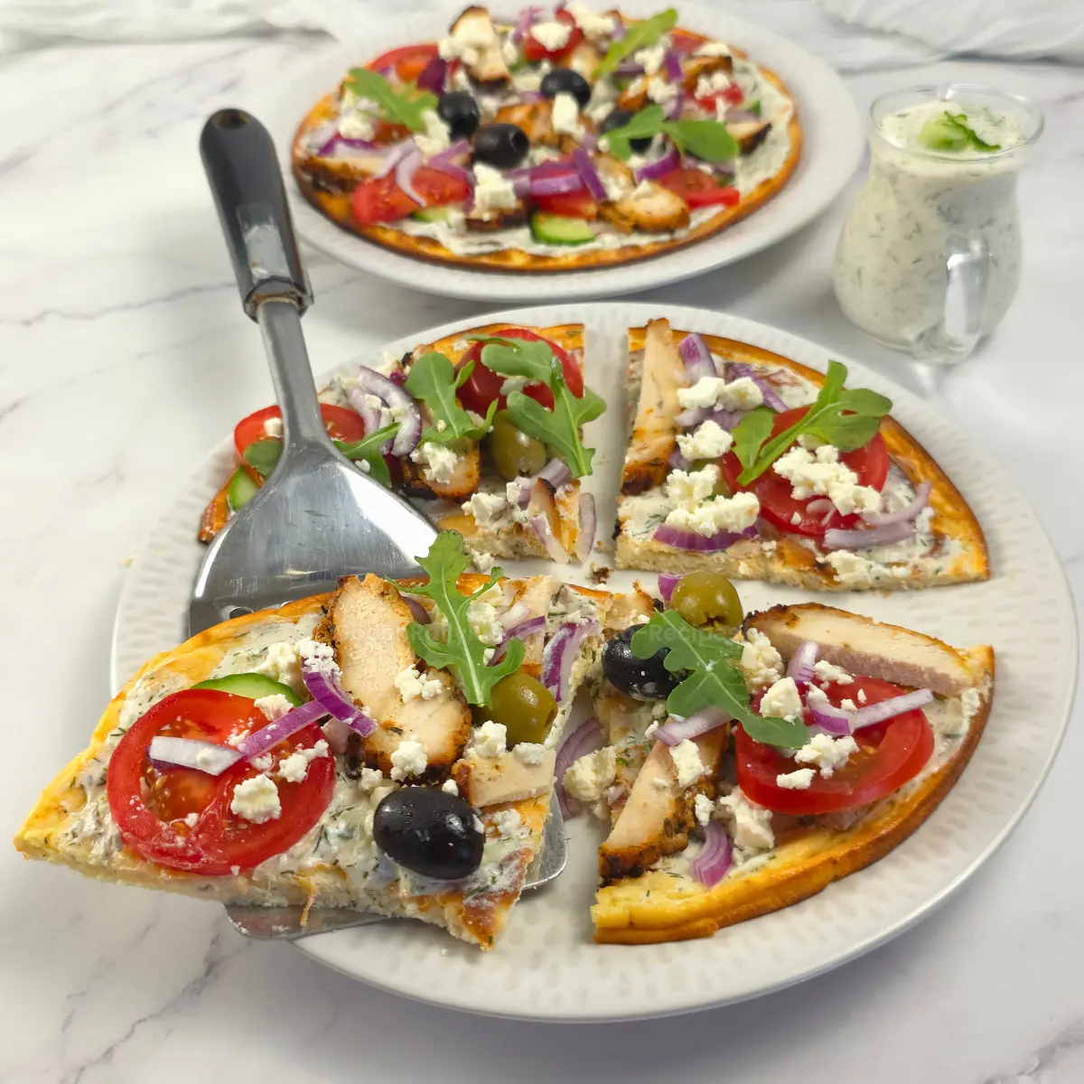 Two sliced cottage cheese flatbread pizzas served cold